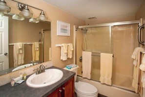 Shower, hair dryer, towels, shampoo