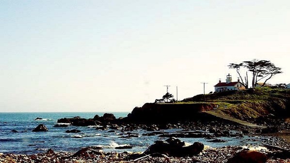 Perched on a grassy hill, this lighthouse offers breathtaking views of the sea.