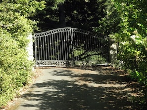 Enter a serene natural oasis through this beautifully maintained garden gate.