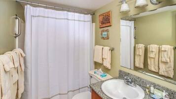 Shower, hair dryer, towels, shampoo