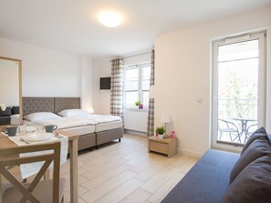 Aquamarina Apartament C-05 | Living room | Flat-screen TV - VacationClub - Aquamarina Apartments (Swinoujscie)