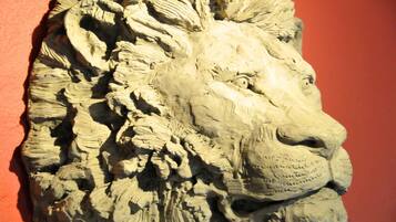 A detailed stone carving of a lion's head.