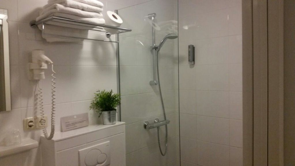 shower, free toiletries, hair dryer, towels