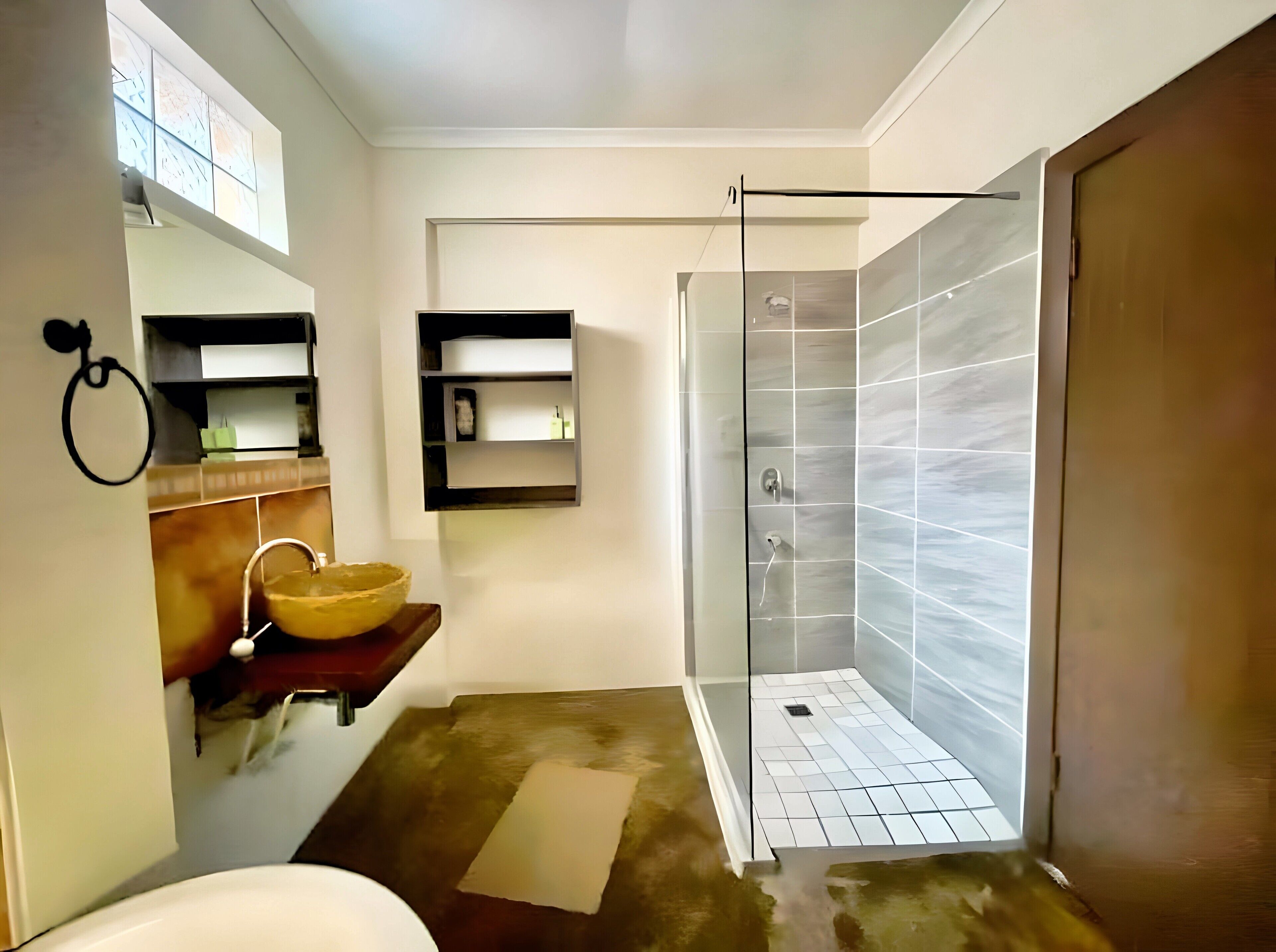 A modern bathroom with a shower, a sink with a bowl, and a mirror.