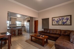 Classic Apartment, 2 Bedrooms, Balcony | Living room | 40-inch LED TV with satellite channels, TV - Camelot Guest House & Apartments (Potchefstroom)