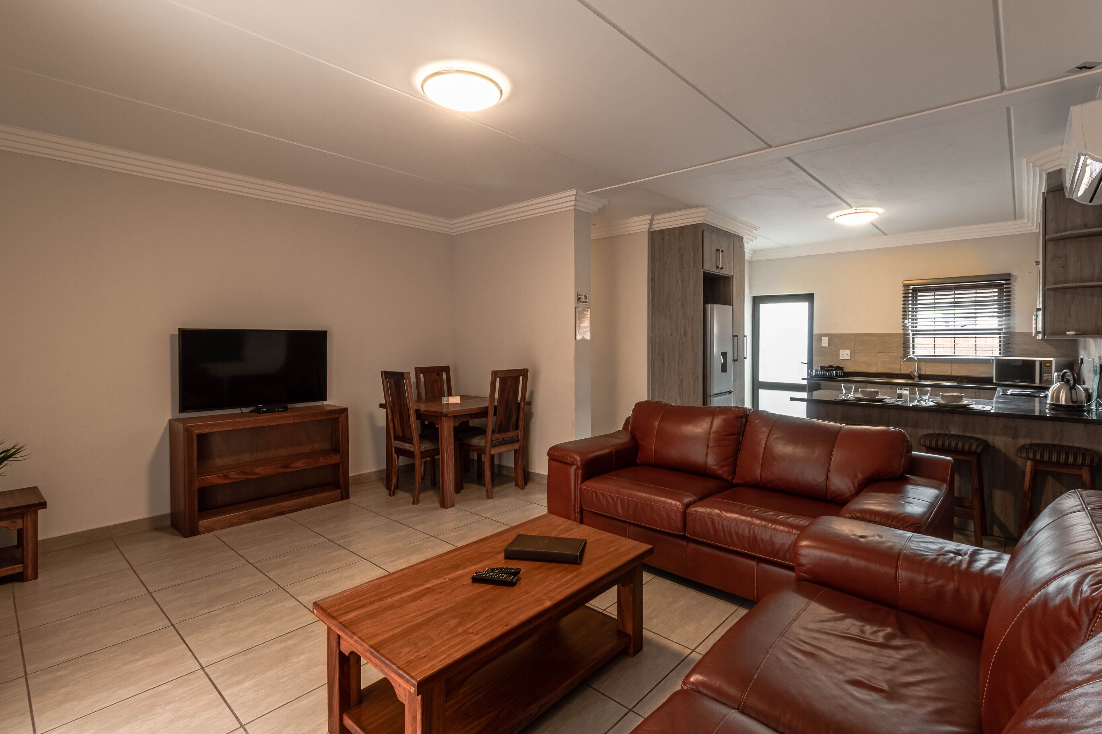 Classic Apartment, 3 Bedrooms, Patio | Living room | 40-inch LED TV with satellite channels, TV