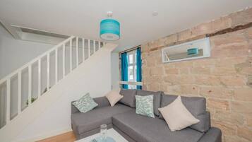 Apartment, 1 Bedroom | Living area | Flat-screen TV