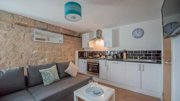 Apartment, 1 Bedroom | Living area | Flat-screen TV