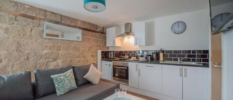 Apartment, 1 Bedroom | Living area | Flat-screen TV