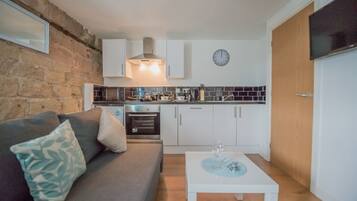 Apartment, 1 Bedroom | Living area | Flat-screen TV