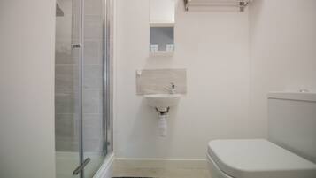 Apartment, 1 Bedroom | Bathroom | Shower, free toiletries, hair dryer, towels