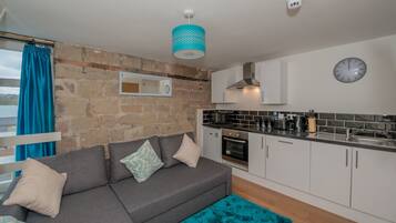 Apartment, 1 Bedroom | Living area | Flat-screen TV