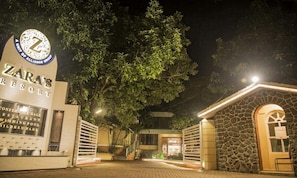 Zara's Resort entrance with a sign indicating a conference hall, restaurant, swimming pool, and children's park. - Zaras Resort (Mawal)