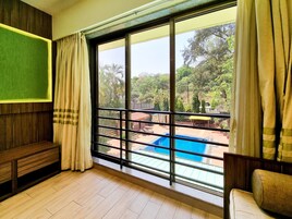 Premium Room (Pool Facing) | In-room safe, iron/ironing board, free WiFi