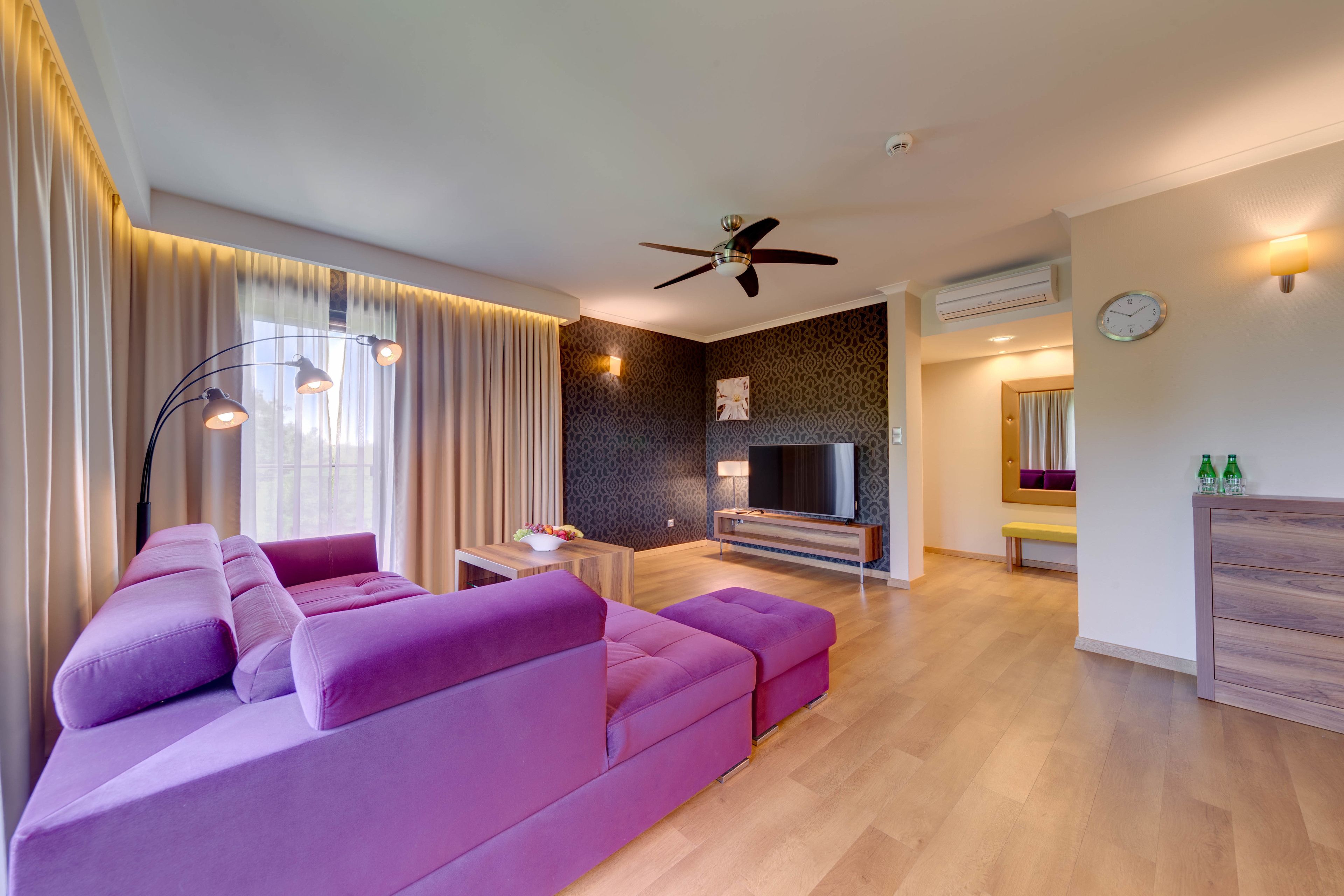 deluxe suite | living area | 32-inch flat-screen tv with cable channels