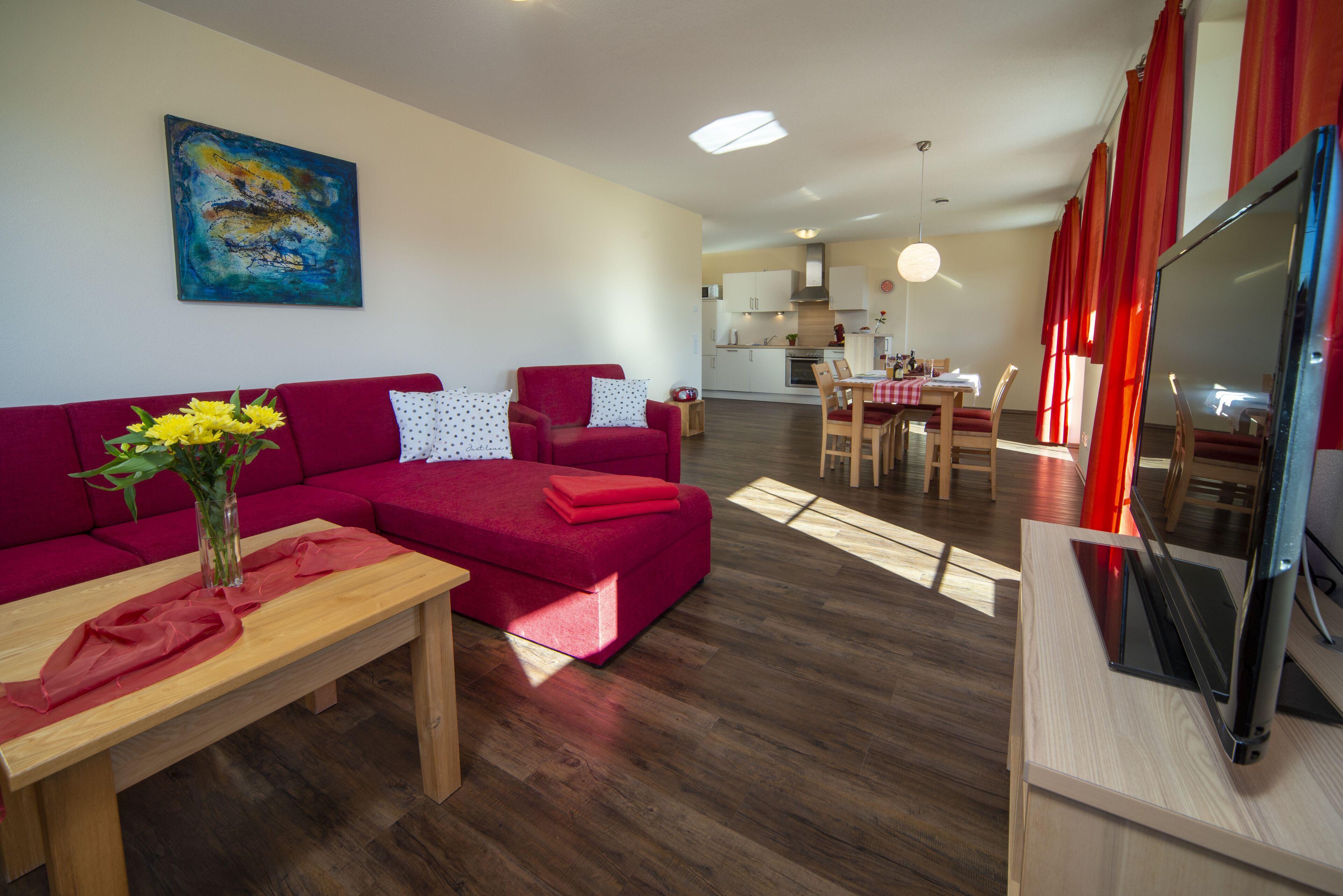 deluxe apartment, 2 bedrooms, lake view | living area | flat-screen tv