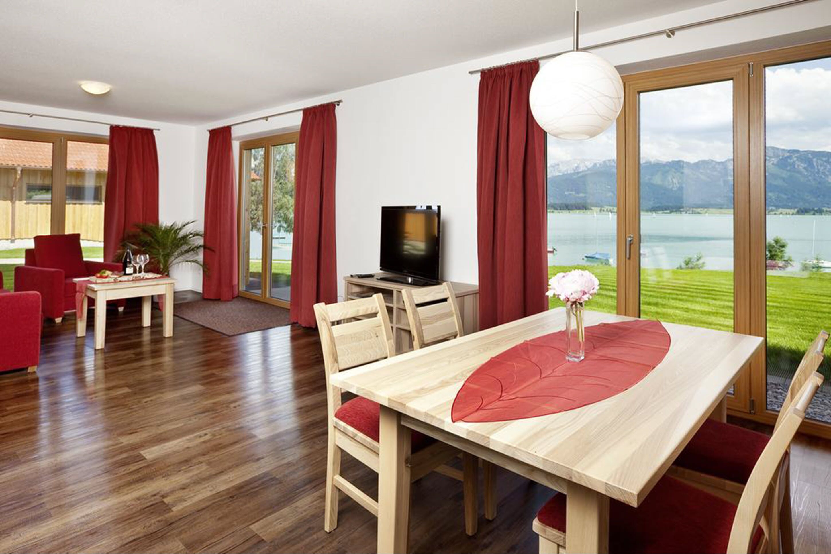 deluxe apartment, 2 bedrooms, lake view | living area | flat-screen tv