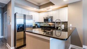  2 Bedroom Condo #1302 | Private kitchen | Coffee/tea maker, full-size fridge, microwave, oven - Crystal Shores by Luxury Gulf Rentals (Gulf Shores)