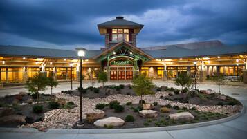The exterior of LeConte Center with a stone facade, large windows, and a central tower.