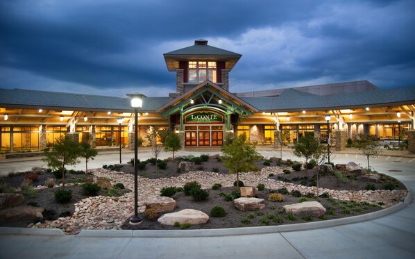 The exterior of LeConte Center with a stone facade, large windows, and a central tower. - Smoky Waters by Hosteeva (Sevierville)