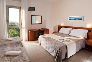 Family Quadruple Room, Sea View | In-room safe, desk, free WiFi, bed sheets