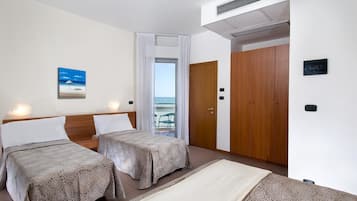 Family Quadruple Room, Sea View | In-room safe, desk, free WiFi, bed sheets