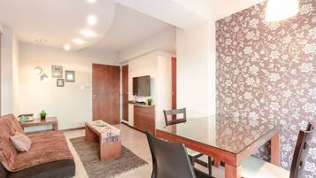 Apartment, 1 Bedroom | Living area | 32-inch LCD TV with cable channels, TV, Netflix