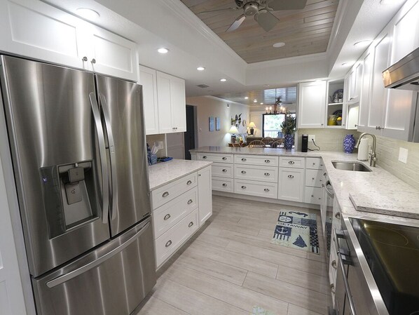 Fridge, microwave, oven, stovetop - The Shore 211-Stylish 2BR Gulffront Condo with Stunning Sunsets & Pool by RVA (Longboat Key)