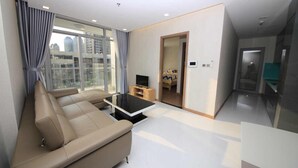 Deluxe Apartment, 2 Queen Beds | Living room | Flat-screen TV - Vinhomes Central Park - Park 7 (Ho Chi Minh City)