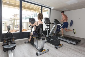 A gym with cardio equipment, a treadmill, and a stationary bike. - Nice apartment on the island of Ile de Ré (RIVEDOUX PLAGE)