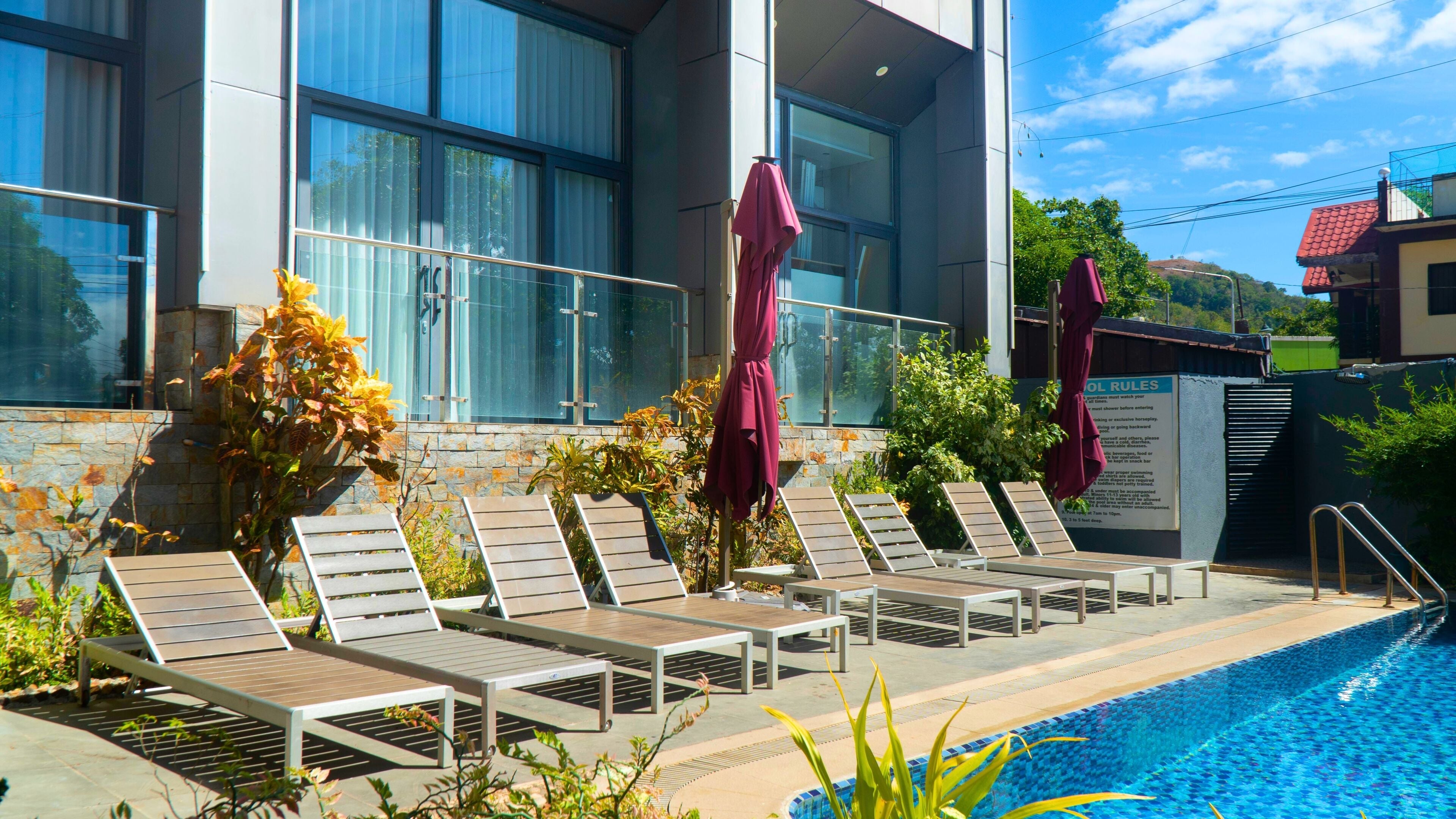 Indoor pool, open 6 AM to 10 PM, pool umbrellas, pool loungers