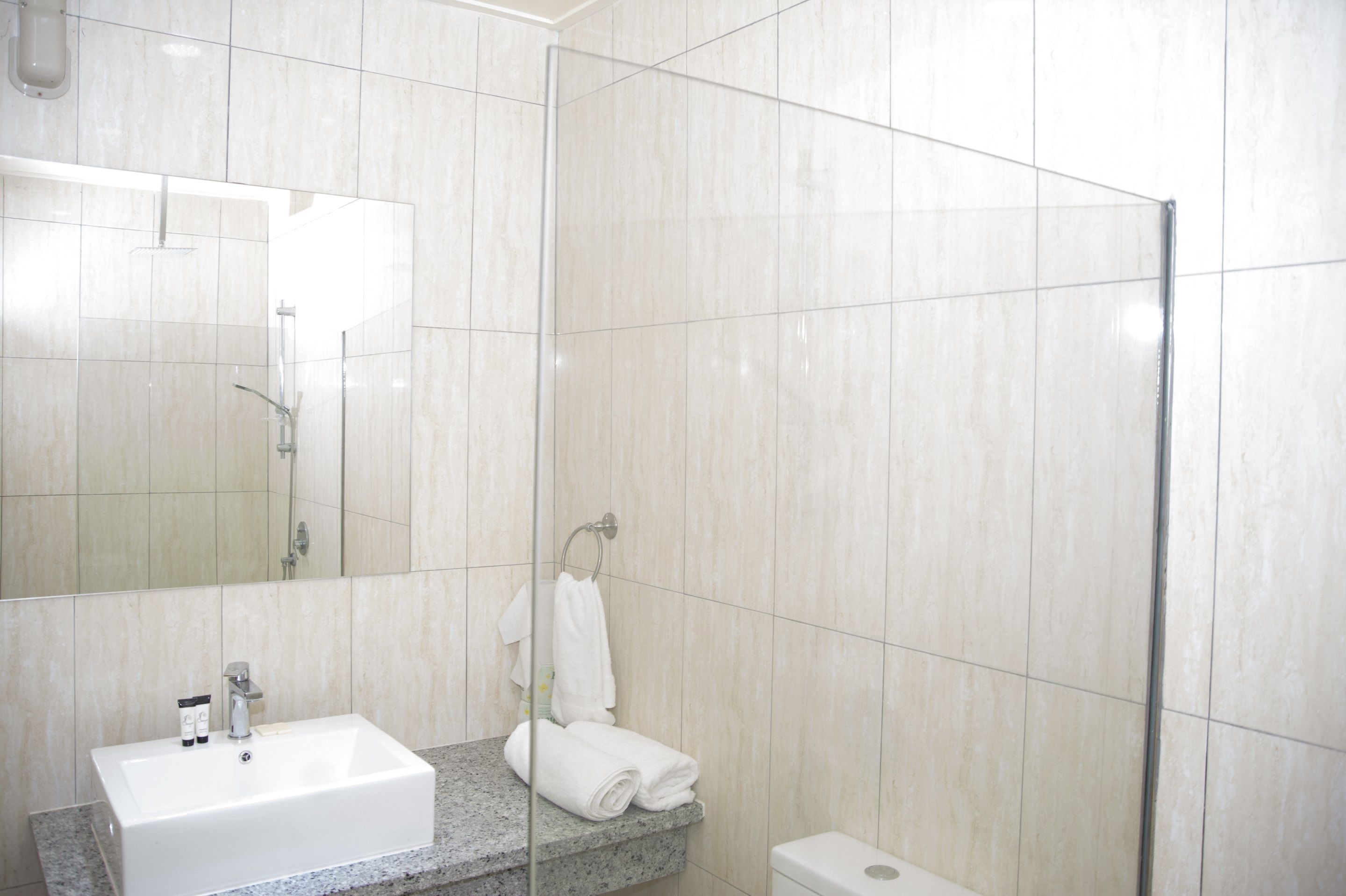 deluxe quadruple room, 2 queen beds, kitchen, mountain view | bathroom | shower, rainfall showerhead, free toiletries, towels