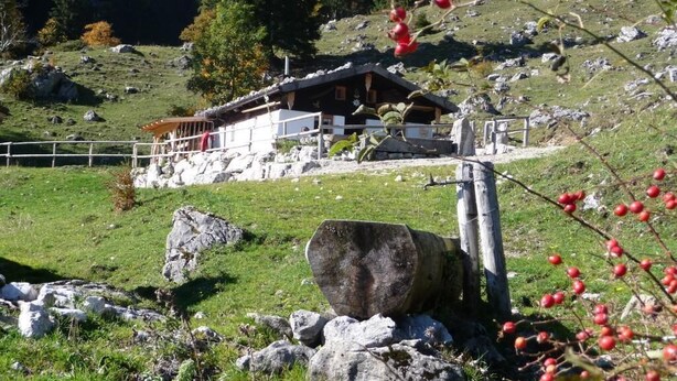 A rustic mountain lodge with a wooden exterior, surrounded by a rocky landscape and a clear sky. - Apartment Geigelstein for 2 pers., 36 sqm, balcony (Schleching)
