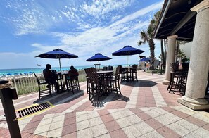 Outdoor dining - Gulf-Front Corner 3BR w/ Wrap Balcony + Sunset Views | Beach service included (Panama City Beach)