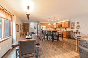 Enjoy meal preparation and dining in this well-equipped kitchen with a central island and adjacent dining area.