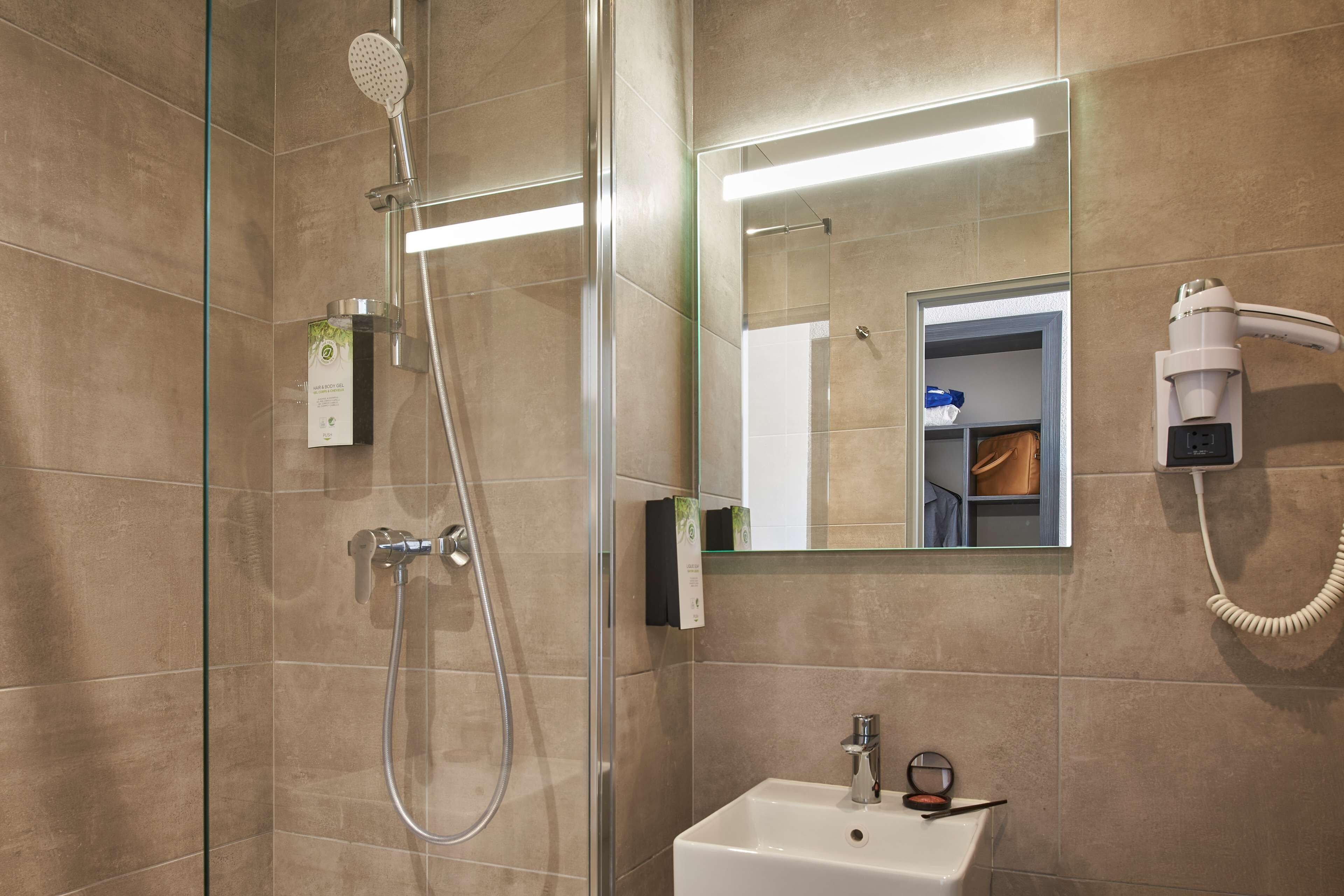 shower, eco-friendly toiletries, hair dryer, towels