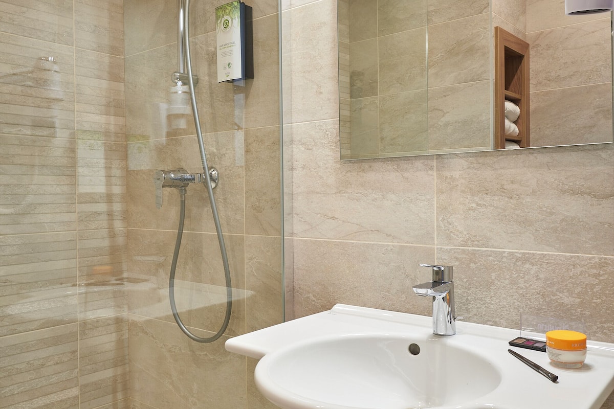 shower, eco-friendly toiletries, hair dryer, towels