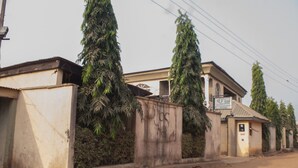 A building with a sign that reads "Pubs." - D Jos Hotel (Ijede)