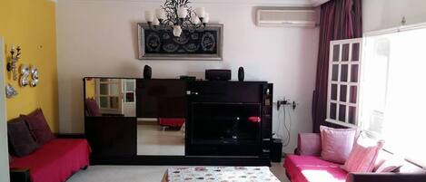 32-inch flat-screen TV with satellite channels, TV