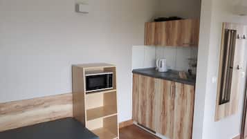 Standard Bungalow, 1 Bedroom, Garden Area | Private kitchenette | Fridge, microwave, stovetop, electric kettle