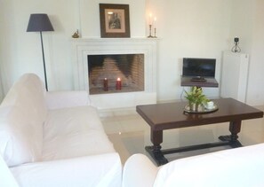 Apartment, 2 Bedrooms | Living area | LCD TV, fireplace