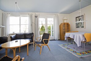 Apartment, 2 Bedrooms | Living room | Flat-screen TV