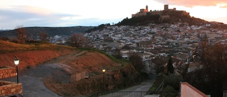 Explore the historic town from a hilltop vantage point, with a castle and paved pathway at your doorstep.
