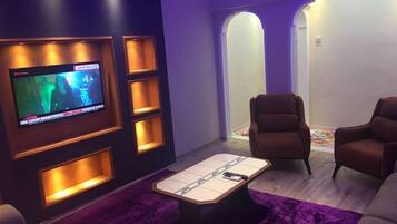 Apartment, 1 Bedroom | Living room | LCD TV