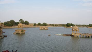 A river with boats and a bridge.