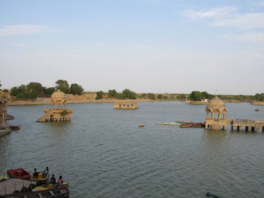 A river with boats and a bridge.