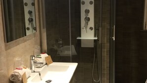 A modern bathroom with a glass-enclosed shower, a white sink, and a mirror. - Hôtel Restaurant Le 8 (Mandelieu-La-Napoule)