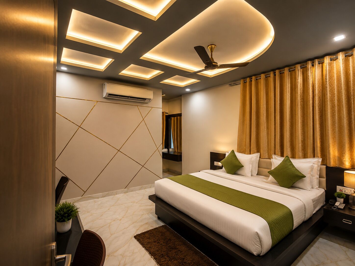 A modern bedroom with a bed, bedside tables, an air conditioning unit, and a ceiling fan.