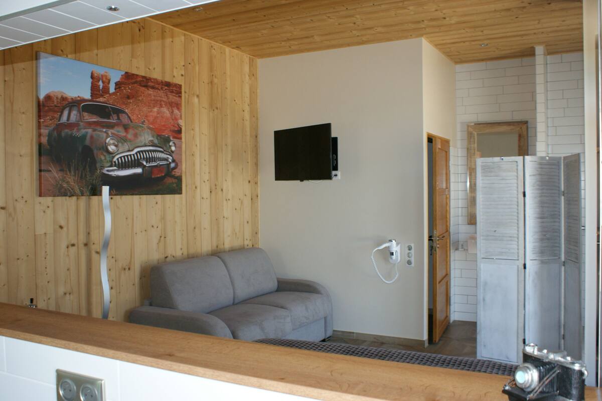 garden suite, 3/4 people | living area | flat-screen tv, heated floors