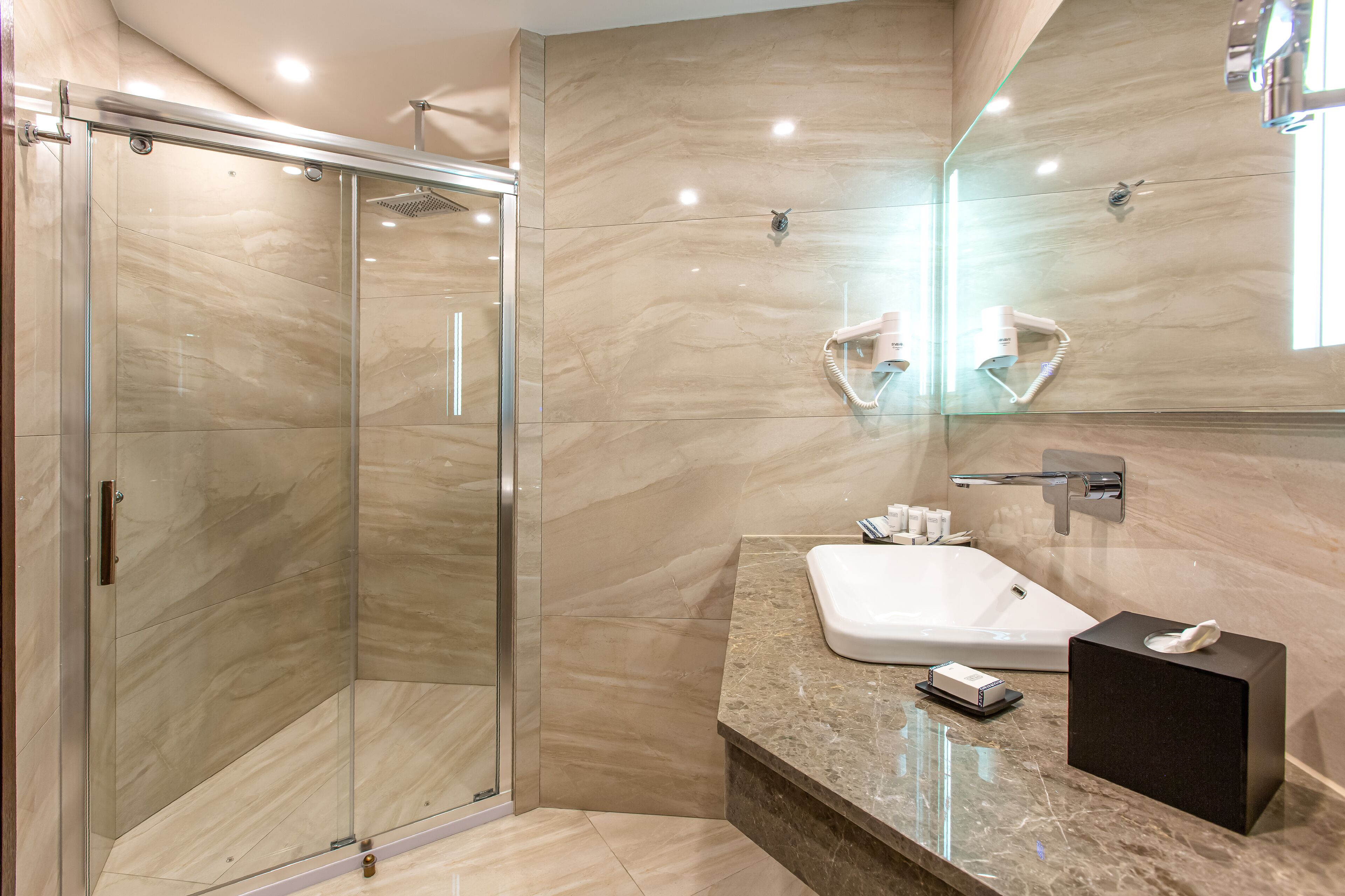 panoramic room, 1 king bed, balcony, city view (a building) | bathroom | free toiletries, hair dryer, slippers, towels